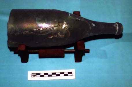 Photo of glass bottle showing nearly black glass.